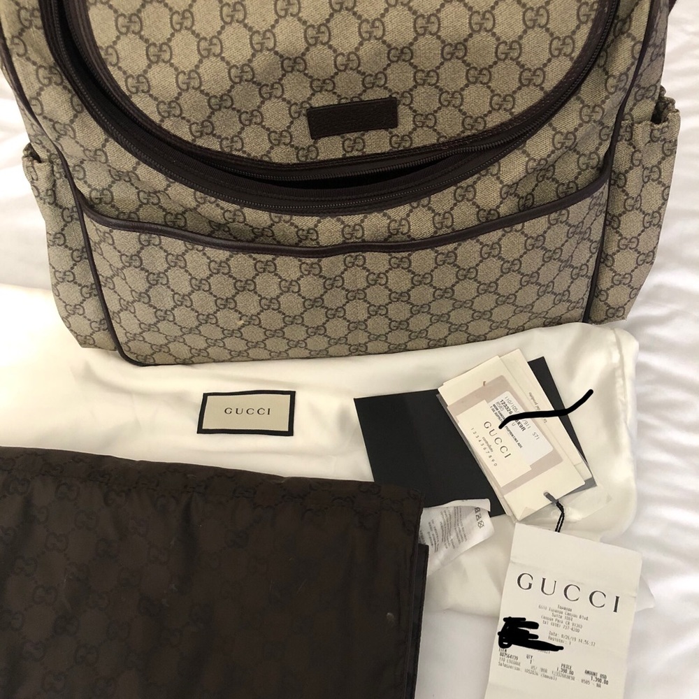 Bought in 2019. Includes diaper changing pad, dust bag, and cert.